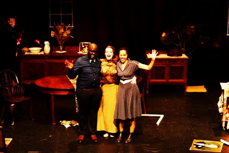 Production still — ensemble on stage