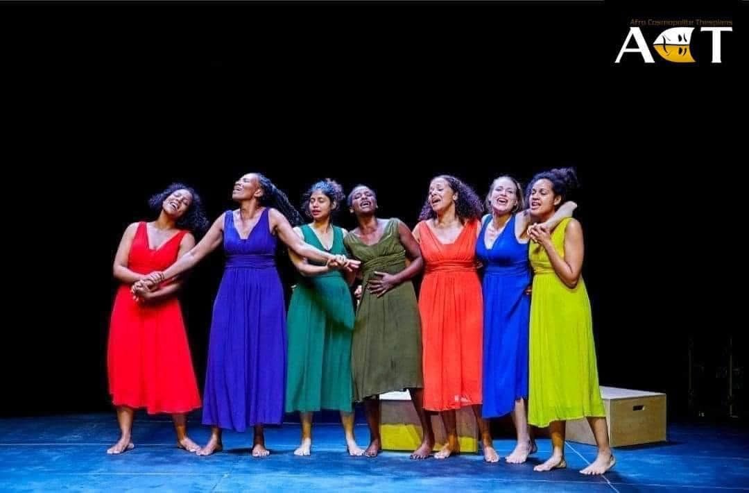 The ensemble in a bright collective image on stage.