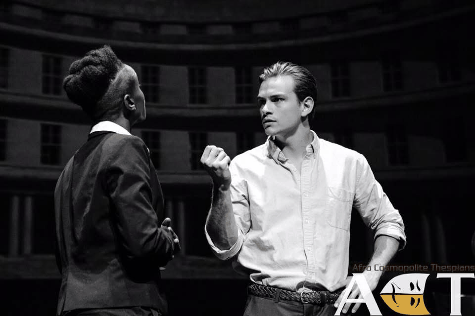 Antonio confronting Shylock in a black-and-white stage still from The Merchant of Venice.