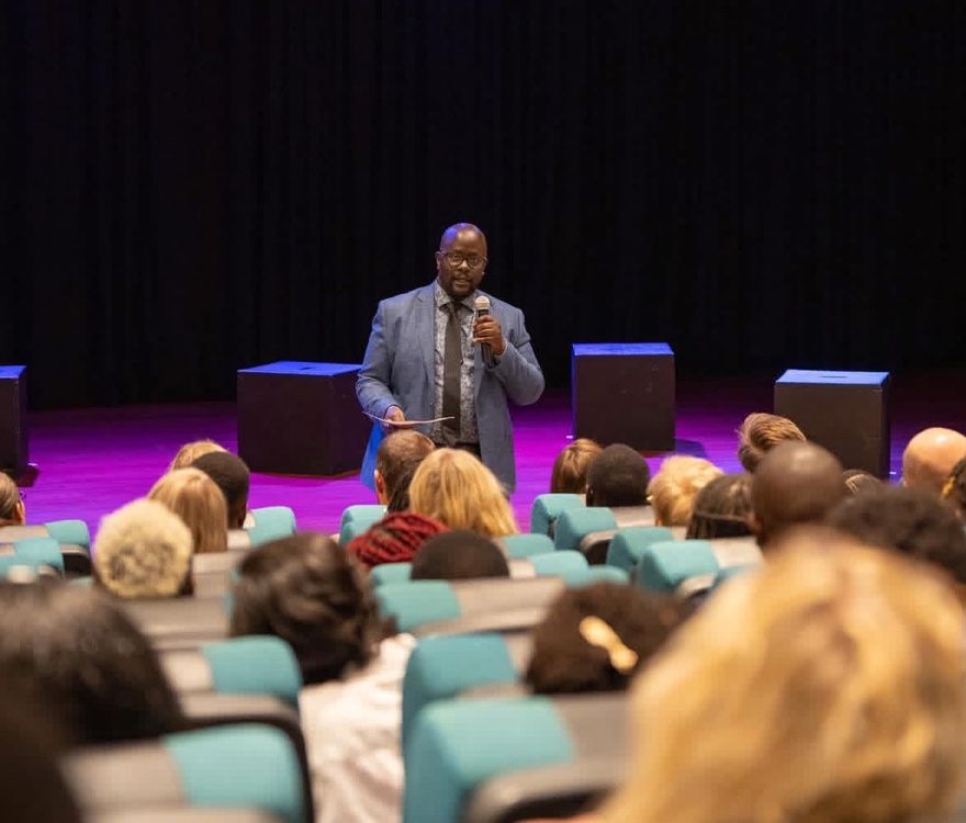 Michael Omoke speaking to an audience